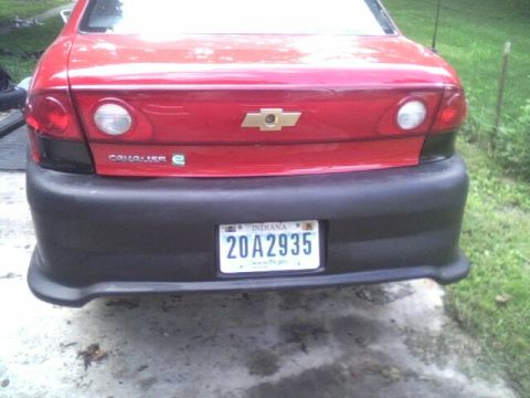 2005 Chevrolet Cavalier - The rear of a red 2005 Chevrolet Cavalier shows a black bumper and an Indiana license plate.