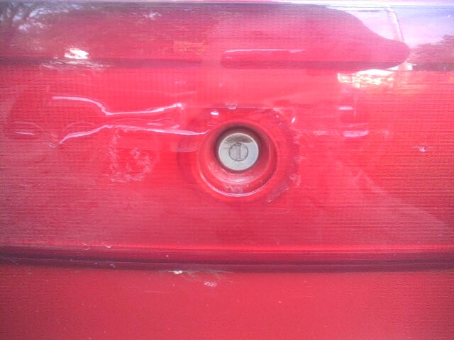 Red 2005 Chevrolet Cavalier trunk lock cylinder