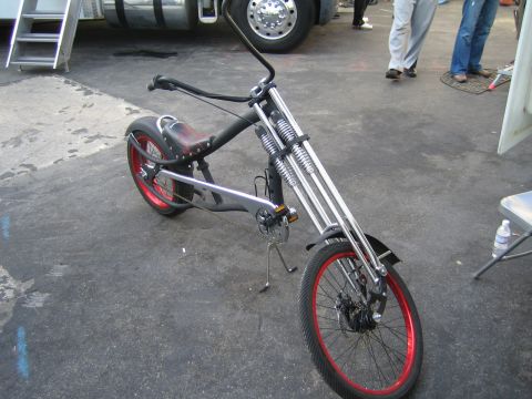 1968 Ford Mustang - Custom chopper bicycle with a unique springer front suspension and red-accented wheels.