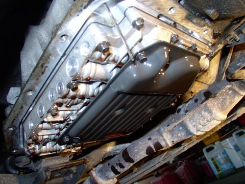 1990 Lincoln Town Car - In this dandy shot you can see all three of the 8mm bolts holding the filter on and the dipstick still probing for ATF.