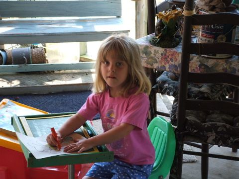 1966 Ford Ranchero - Young girl sits at a small desk, focused on her drawing.
