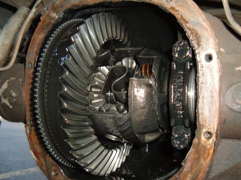 1989 Ford Bronco - Differential gears are visible inside the axle housing of a vehicle.