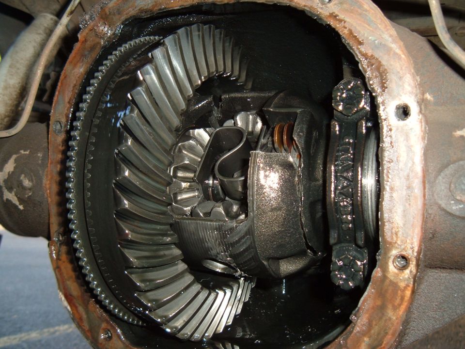 Close-up of differential gears inside a vehicle's axle housing