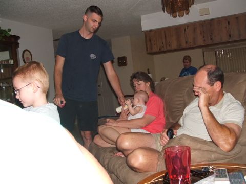 1966 Ford Ranchero - A family scene unfolds in a living room, with several individuals interacting.