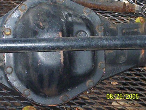 1989 Ford Bronco - A close-up view of a vehicle's rear axle differential housing, showing its mechanical components.