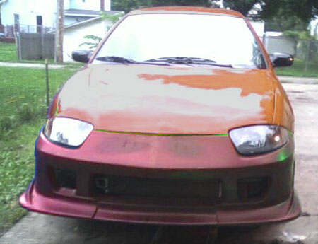 2005 Chevrolet Cavalier - Car with custom body kit and two-tone paint job seen from the front.