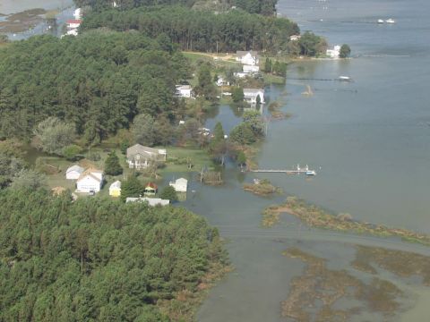 1969 Ford Bronco - Flooded coastal properties show the impact of high water levels on homes and vegetation.