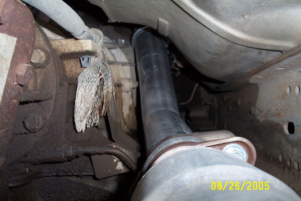 underneath vehicle showing exhaust pipe and transmission components
