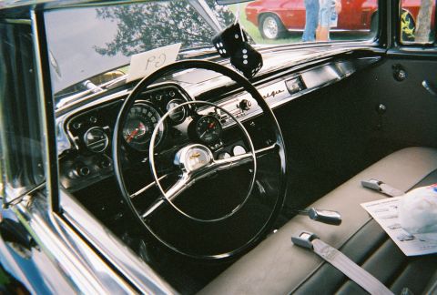 1996 Ford F-150 - A classic car's interior is shown, a prominent steering wheel, dashboard, and seating.