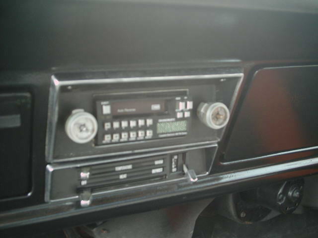 1971 Ford F-100 interior showing aftermarket radio and climate controls