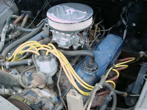 1971 Ford F-100 - The engine bay shows a Ford V8 with a chrome air cleaner and visible spark plug wires.