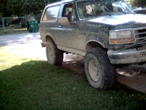 1992 Ford Bronco - This 1992 Ford Bronco is covered in mud, suggesting it has seen some off-road action.