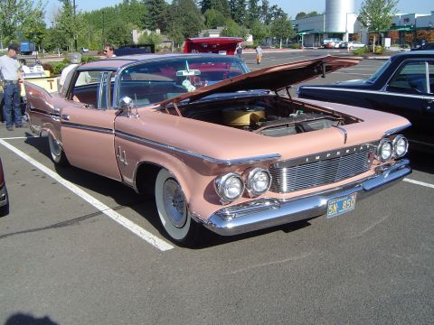 1964 Ford Fairlane - This 1959 Imperial sedan, with its distinctive grille and fins, is displayed with its hood open.