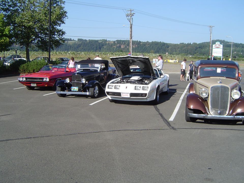 White Pontiac Firebird with hood open, front view