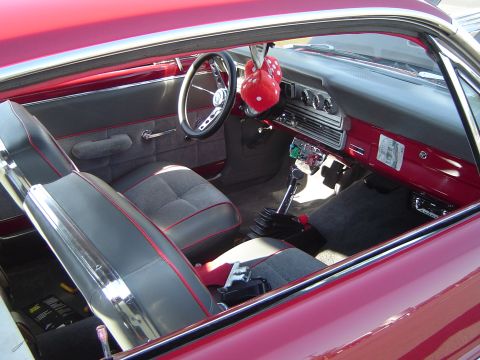 1964 Ford Fairlane - The interior of a 1964 Ford Fairlane features a floor shifter and two-tone seating.