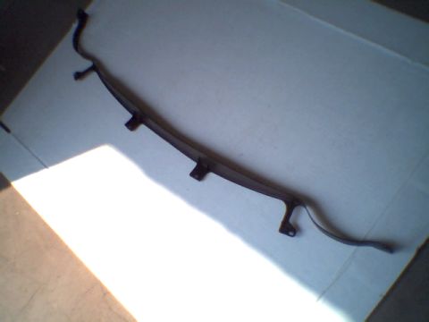 1978 Ford Mustang II - This is a car part, not a 1978 Ford Mustang II. The part is dark and curved with mounting tabs.