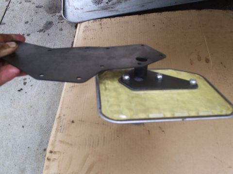 1979 Ford F-150 - A transmission filter and gasket are shown, likely for a vehicle maintenance task.