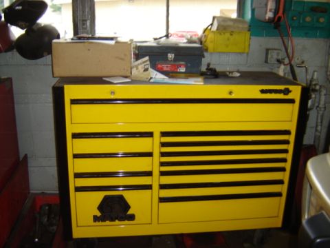1992 Ford Bronco - A yellow Matco tool chest sits in a workshop environment with various items on top.