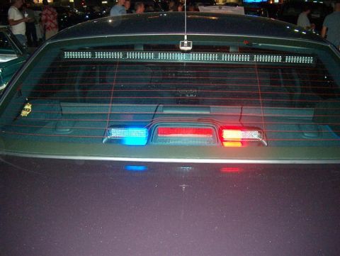 2001 Ford Crown Victoria - Rear view of a 2001 Ford Crown Victoria equipped with a light bar and emergency lights.