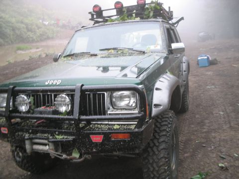 1992 Ford Bronco - This modified Jeep Cherokee XJ is equipped for off-road adventures, a heavy-duty bumper and roof-mounted lights.