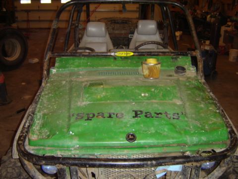 1992 Ford Bronco - This buggy has a roll cage and 'Spare Parts' painted on its green hood, with a John Deere logo.