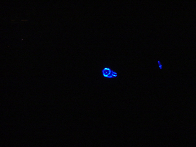 blue glowing car part with text 'SUPERMOTORS' at bottom right