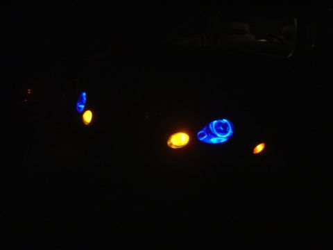 1998 Ford Taurus - Illuminated interior lights glow in the dark, with visible text at the bottom right.