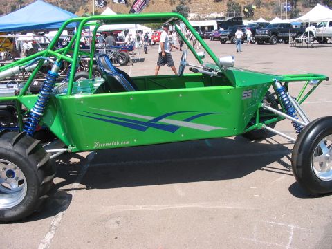 1986 Ford Bronco - Side view of a custom green sand rail buggy with "XtremeFab.com" visible on the body.