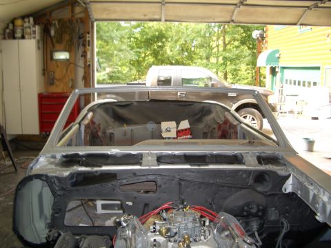 1967 Pontiac GTO - Interior view of a 1967 Pontiac GTO undergoing restoration work in a garage.