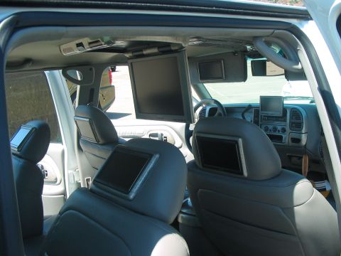 1986 Ford Bronco - This SUV's interior has been modified with several entertainment screens for passengers.