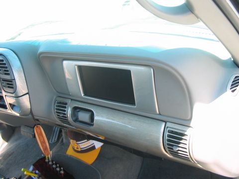 1986 Ford Bronco - Interior view of a vehicle's dashboard, showing a central screen and textured trim.