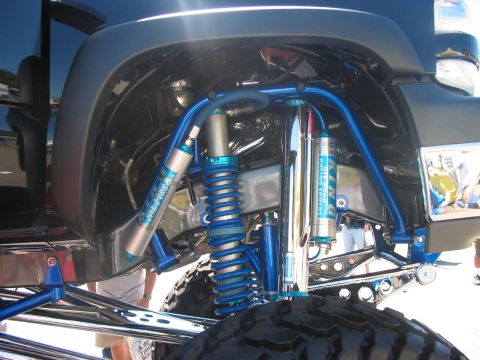 1986 Ford Bronco - Custom suspension with King Off-Road Racing Shocks is visible on a modified truck.