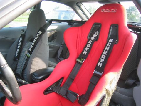 1993 Ford Probe - Car interior red Sparco racing seats and Summit racing harnesses.