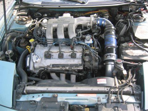 1993 Ford Probe - The V6 engine bay features a PRM intake system and is shown with the hood open.