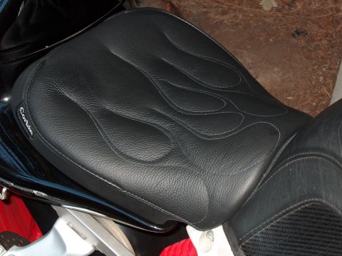 2002 Suzuki TL1000R - A black Corbin motorcycle seat with flame stitching is shown up close.