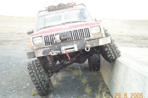 1988 Jeep Cherokee - This modified 1988 Jeep Cherokee is equipped for off-road adventures with a winch and large tires.