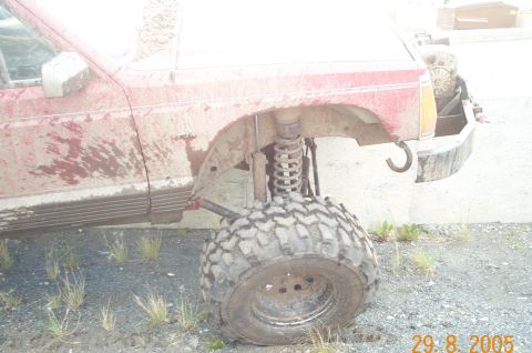 1988 Jeep Cherokee - This heavily modified SUV appears to have been used for off-roading, as evidenced by the mud and large tires.