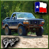 1993 Ford Bronco - This Ford Bronco is shown off-road with a Texas flag graphic overlay.