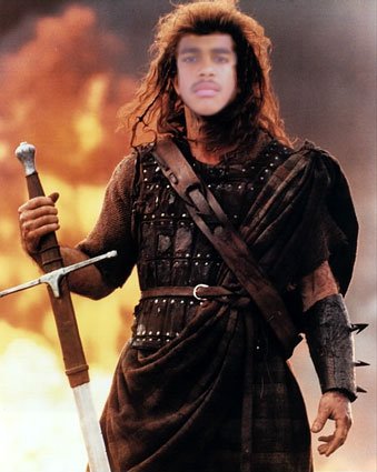 2000 Isuzu Rodeo - A man dressed as a warrior holds a sword in front of a fiery backdrop, with a website address at the bottom.