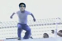 2000 Isuzu Rodeo - A man is captured in a dynamic pose, possibly during a performance or athletic event.