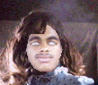 2000 Isuzu Rodeo - A person wearing a wig and makeup is shown in this close-up photo.