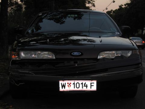 1992 Ford Crown Victoria - Front view of a black 1992 Ford Crown Victoria with a license plate.