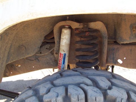 1981 Ford F-150 - The old shock mount on top is in the bucket, and doesn't quite line up with the new lower mount on the radius arms. I need to fix this at s…