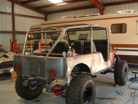 1964 Jeep CJ5 - Customized 1964 Jeep CJ5 undergoing modifications in a workshop setting.