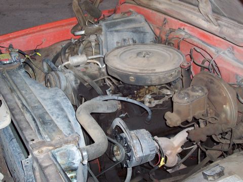 1972 Chevrolet C/K Pickup - The engine bay of a 1972 Chevrolet C/K Pickup shows a V8 engine with various components.