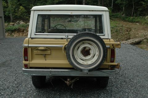 1972 Ford Bronco - The rear of a classic Ford Bronco shows its spare tire and trailer hitch.