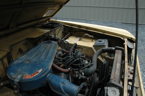 1972 Ford Bronco - Engine bay of a 1972 Ford Bronco, showing the V8 engine and radiator. Handwritten markings are visible on the radiator.