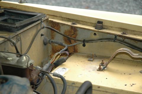 1972 Ford Bronco - Wiring and rust are visible in the engine bay of this vehicle.