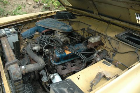 1972 Ford Bronco - The engine bay of a 1972 Ford Bronco shows its V8 engine and associated components.