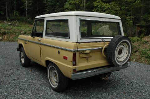 1972 Ford Bronco - This 1972 Ford Bronco is viewed from a three-quarter rear angle, showing its distinctive body style and spare tire.